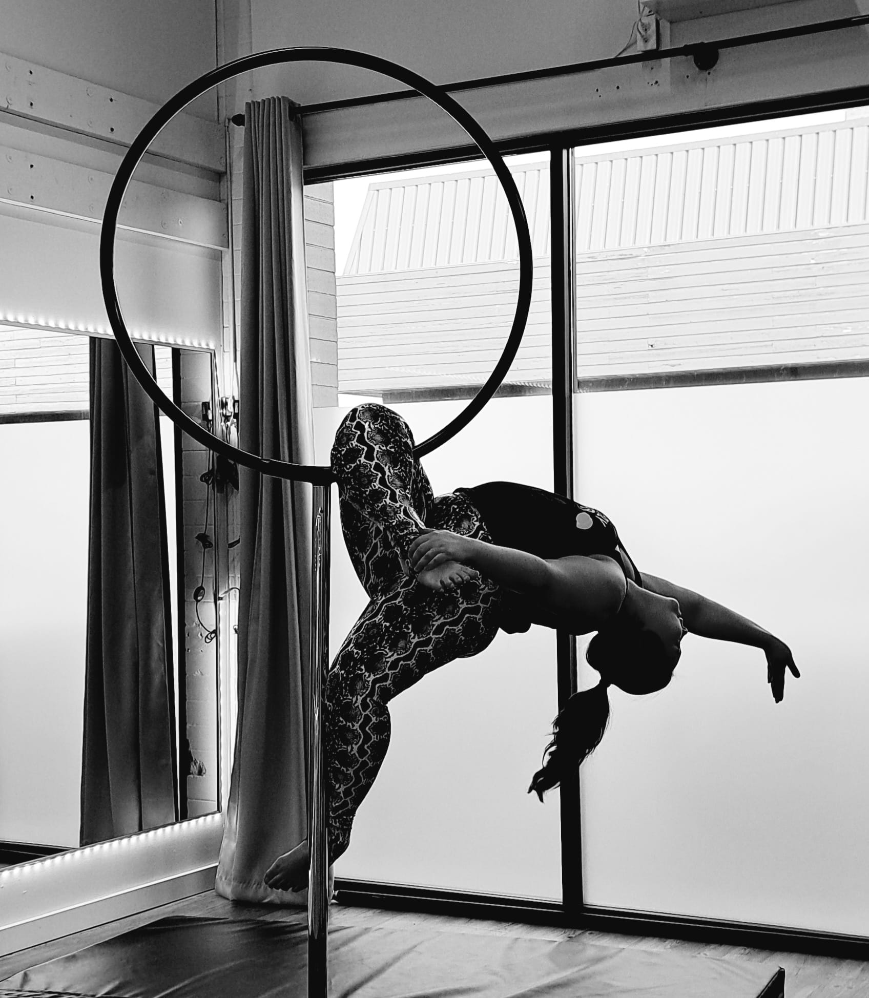 Kait practicing aerial movement, a grounding practice that builds confidence, awareness, and self-trust.